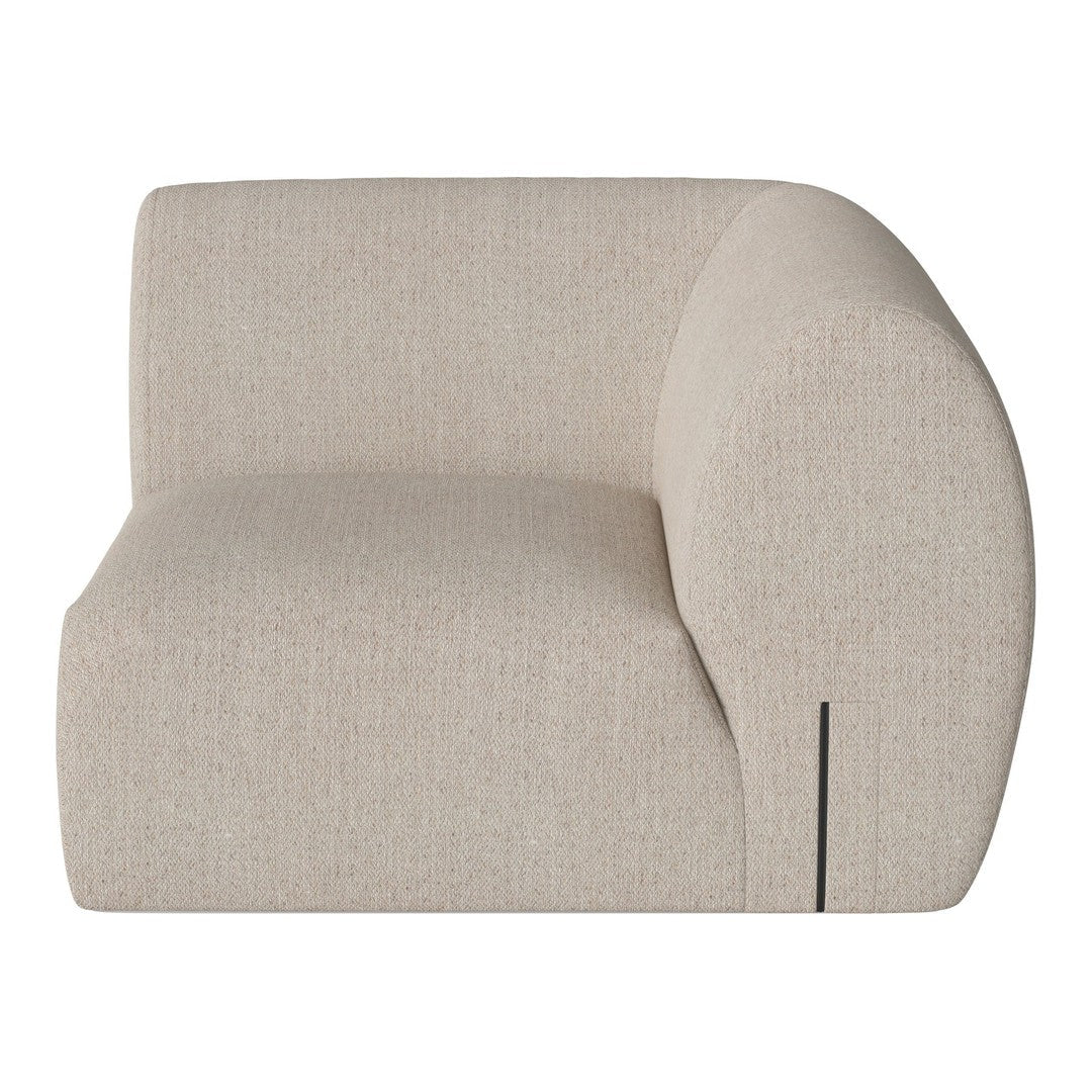 Beige curved sofa section with a textured finish and minimalist black detailing. Ideal for modern interiors.
