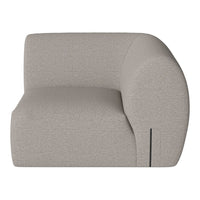 Curved, modern sofa in a soft light gray fabric with a textured pattern, ideal for contemporary interiors.