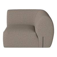Contemporary beige sectional sofa with a textured, minimalist design and rounded edges, ideal for modern decor.