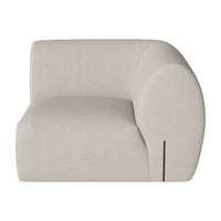 Beige curved sofa with a smooth texture and minimalist design, featuring a modern, clean-line aesthetic.