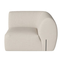 Cream-colored curved armchair with a smooth, minimalist design and soft fabric texture. Perfect for modern interiors.