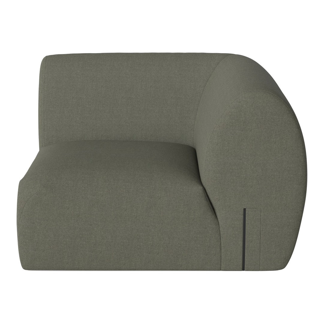 Curved olive green sofa with a smooth texture and minimalistic design, featuring subtle stitching details.