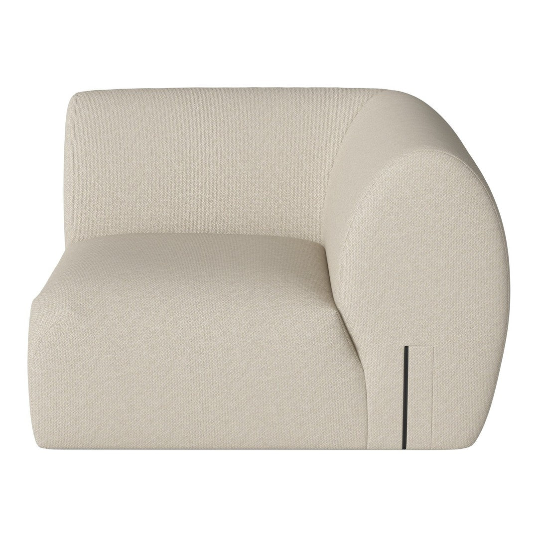 Cream-colored curved armchair with a textured surface and minimalistic pattern, perfect for modern decor.