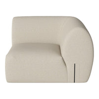 Cream-colored curved armchair with a textured surface and minimalistic pattern, perfect for modern decor.