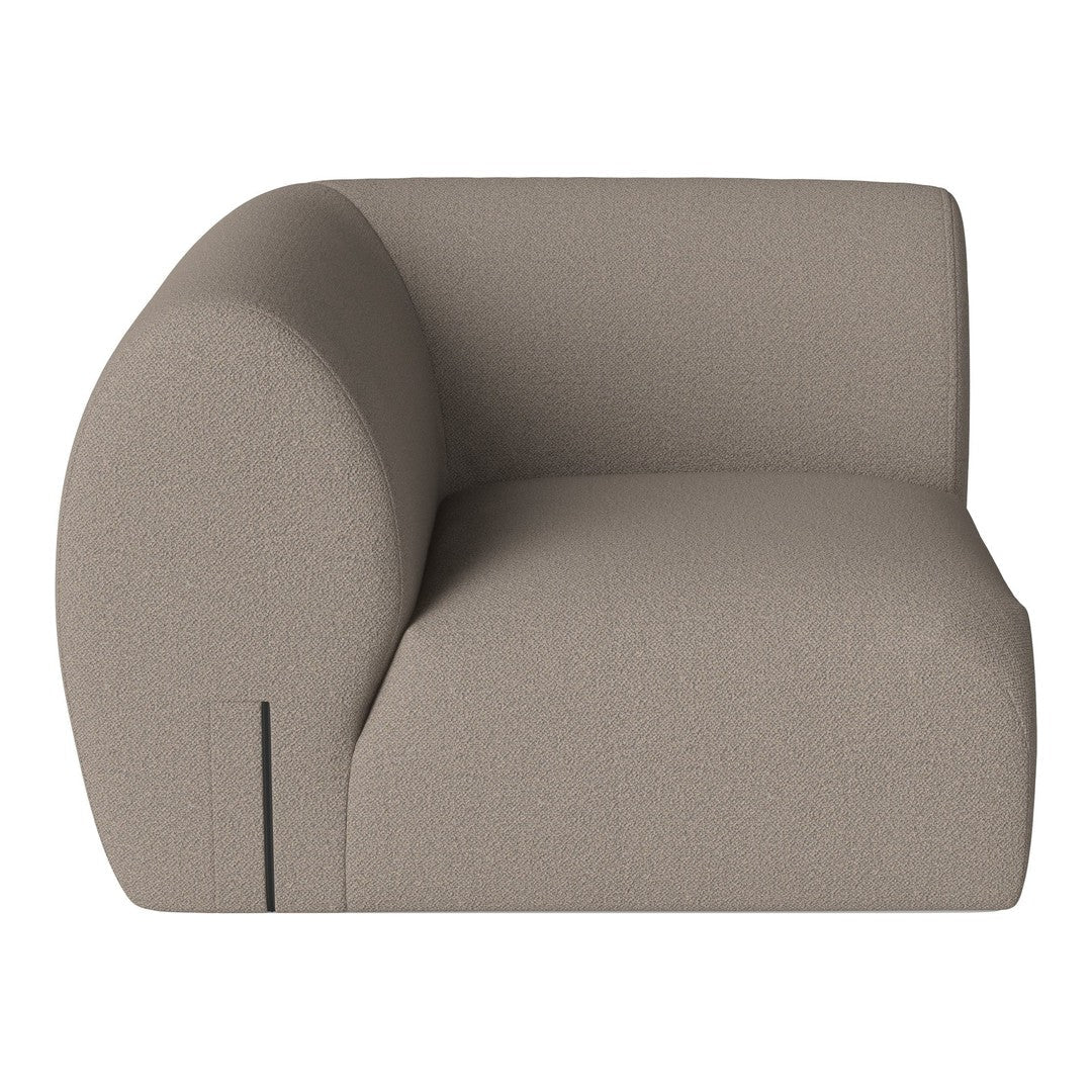 Beige curved sofa with a textured fabric, featuring a minimalist design and smooth lines for a modern aesthetic.