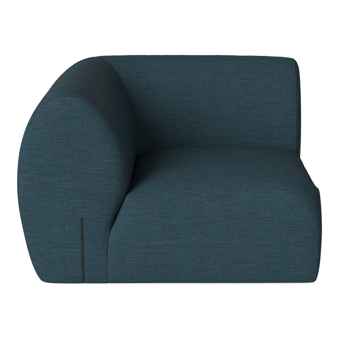 Teal upholstered chair with a textured pattern, featuring smooth curves and minimalist design. Perfect for modern decor.