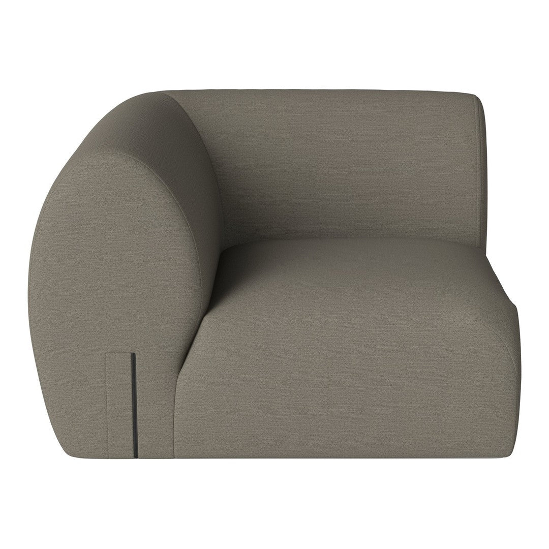 Contemporary beige armchair with a minimalist design and smooth, curved edges. Ideal for modern interiors.
