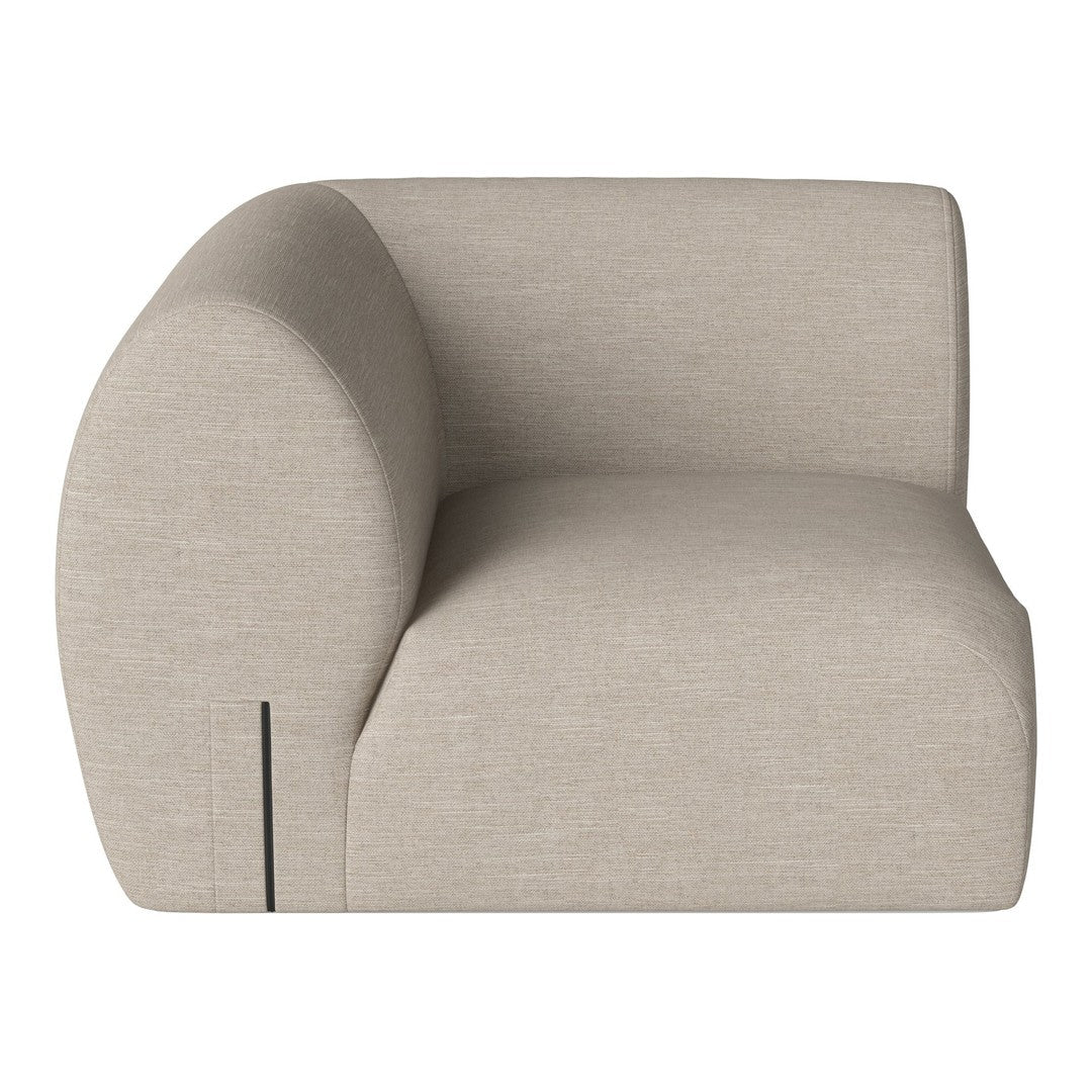 Beige curved armchair with a smooth texture and minimalistic design. Ideal for modern living spaces.