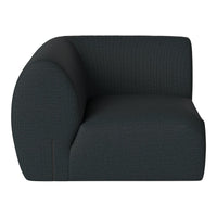 Dark teal upholstered accent chair with a unique curved shape and subtle geometric pattern. Modern and stylish design.