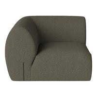 Olive green textured upholstery on contemporary curved armchair, perfect for modern interior decor.