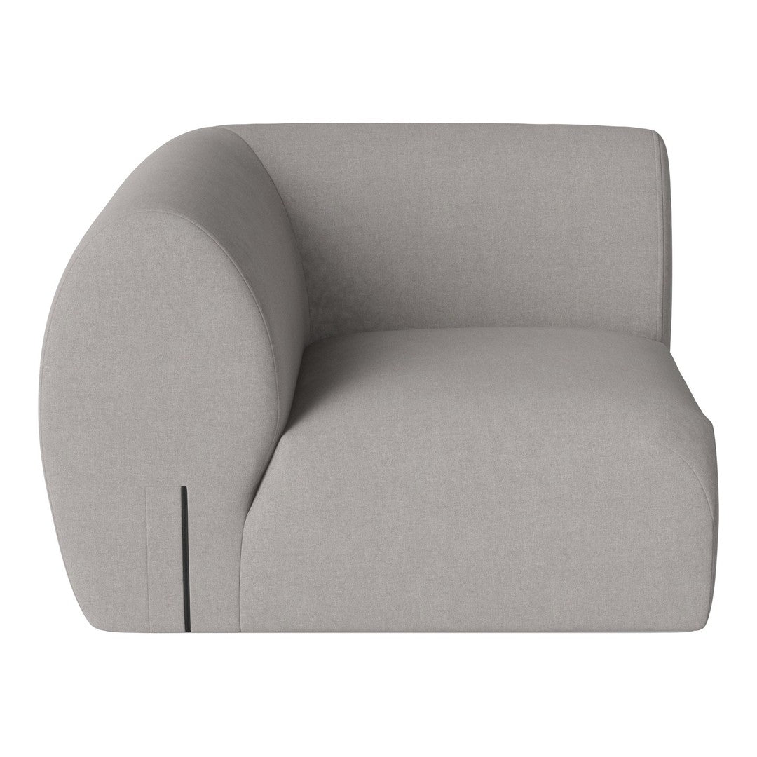 Light gray upholstered chair with a rounded back and minimalist design, showcasing a smooth, soft texture.