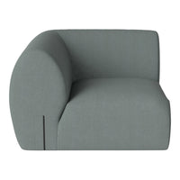 Light green modern accent chair with smooth, curved lines and minimalist design. Perfect for contemporary decor.