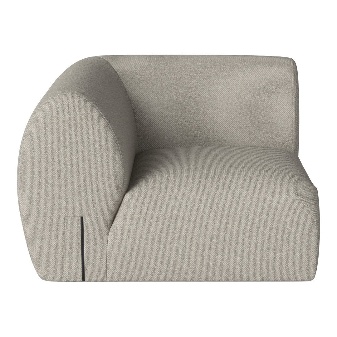 Beige curved upholstered chair with a smooth, textured fabric pattern, designed for modern interiors.