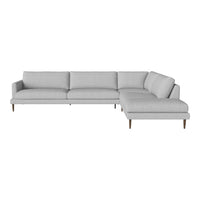 Gray sectional sofa with clean lines and subtle textured fabric, featuring light wood legs for a modern look.