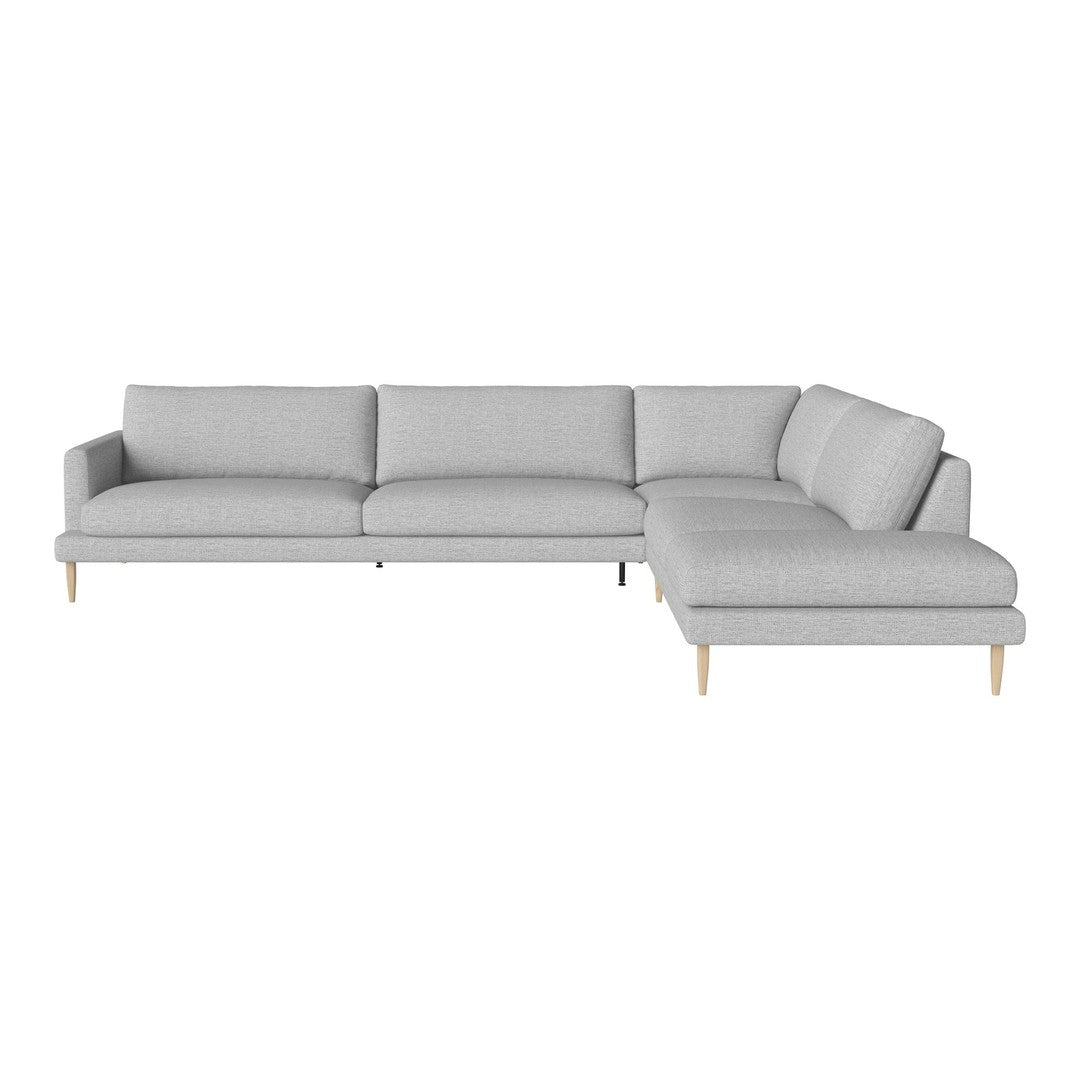 Light gray sectional sofa with a modern minimalist design and smooth fabric texture. Natural wooden legs.