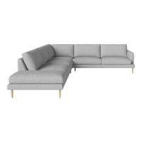 Light gray sectional sofa with a minimalist design and soft fabric, featuring clean lines and wooden legs.