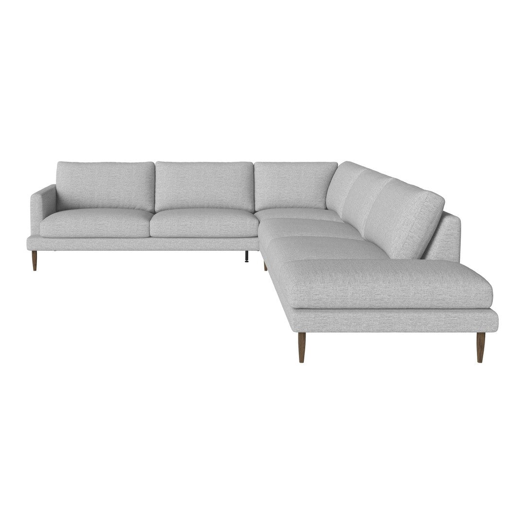 Light gray sectional sofa with a minimalist design and smooth fabric, featuring clean lines and elegant wooden legs.