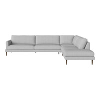 Light gray sectional sofa with a sleek, modern design and subtle textured fabric patterns. Elegant wooden legs.