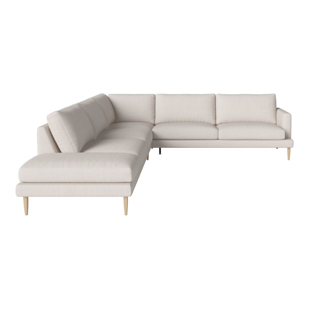 Light beige sectional sofa with simple, clean lines and light wooden legs, perfect for modern decor.