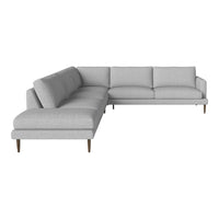 Light gray sectional sofa with a smooth fabric finish and clean lines, featuring minimalistic wood legs.