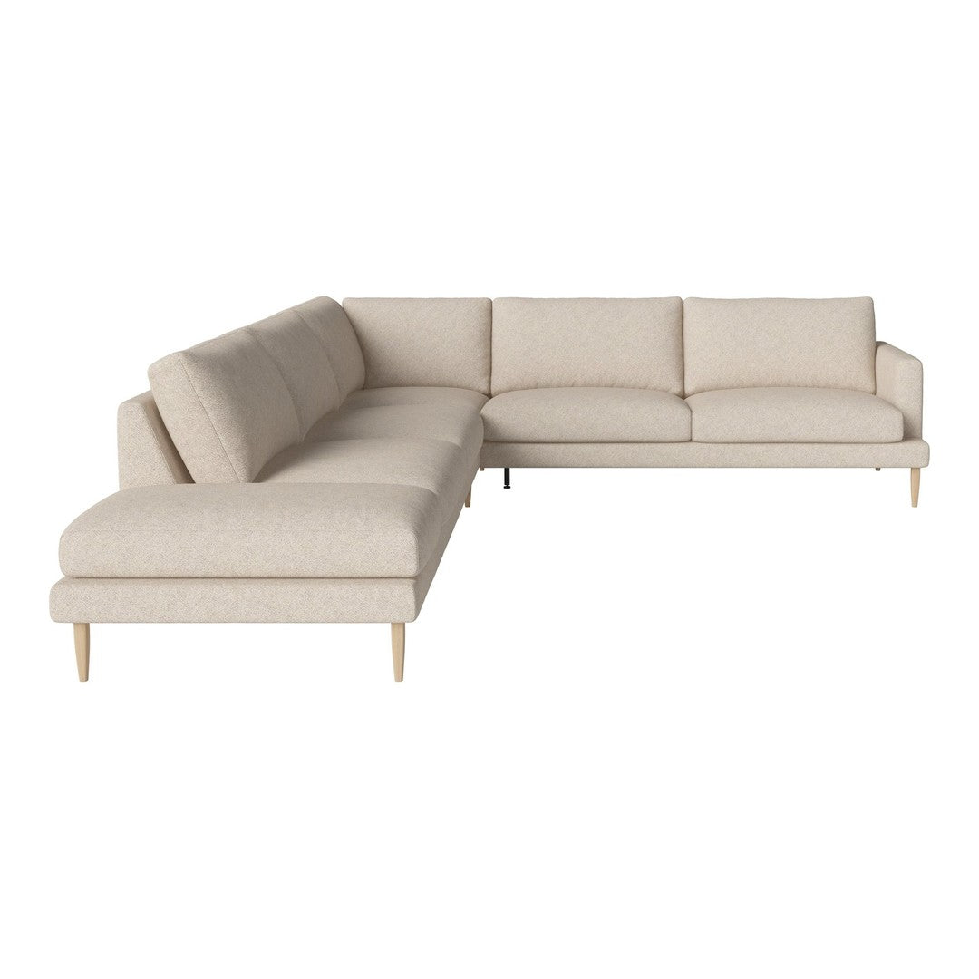 Light beige sectional sofa with a simple, textured fabric and wooden legs, blending minimalist design with comfort.