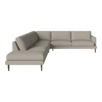 Light grey sectional sofa with plush cushions and sleek wooden legs, featuring a minimalist design and clean lines.