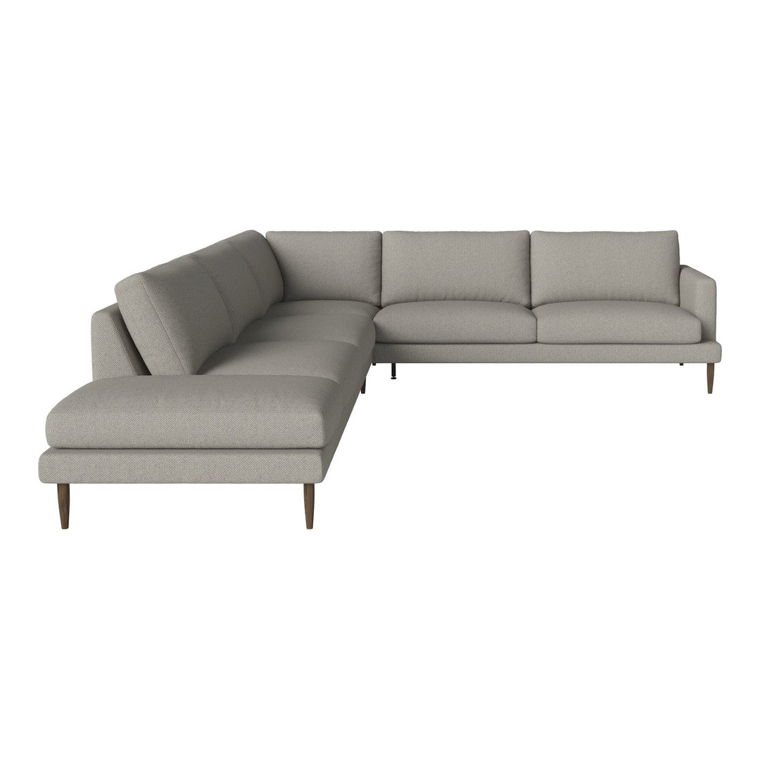 Light gray sectional sofa with textured fabric and minimalist design, accented by sleek wooden legs.