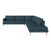 Teal upholstered sectional sofa with a sleek, minimalist design and light wooden legs. Perfect for modern interiors.