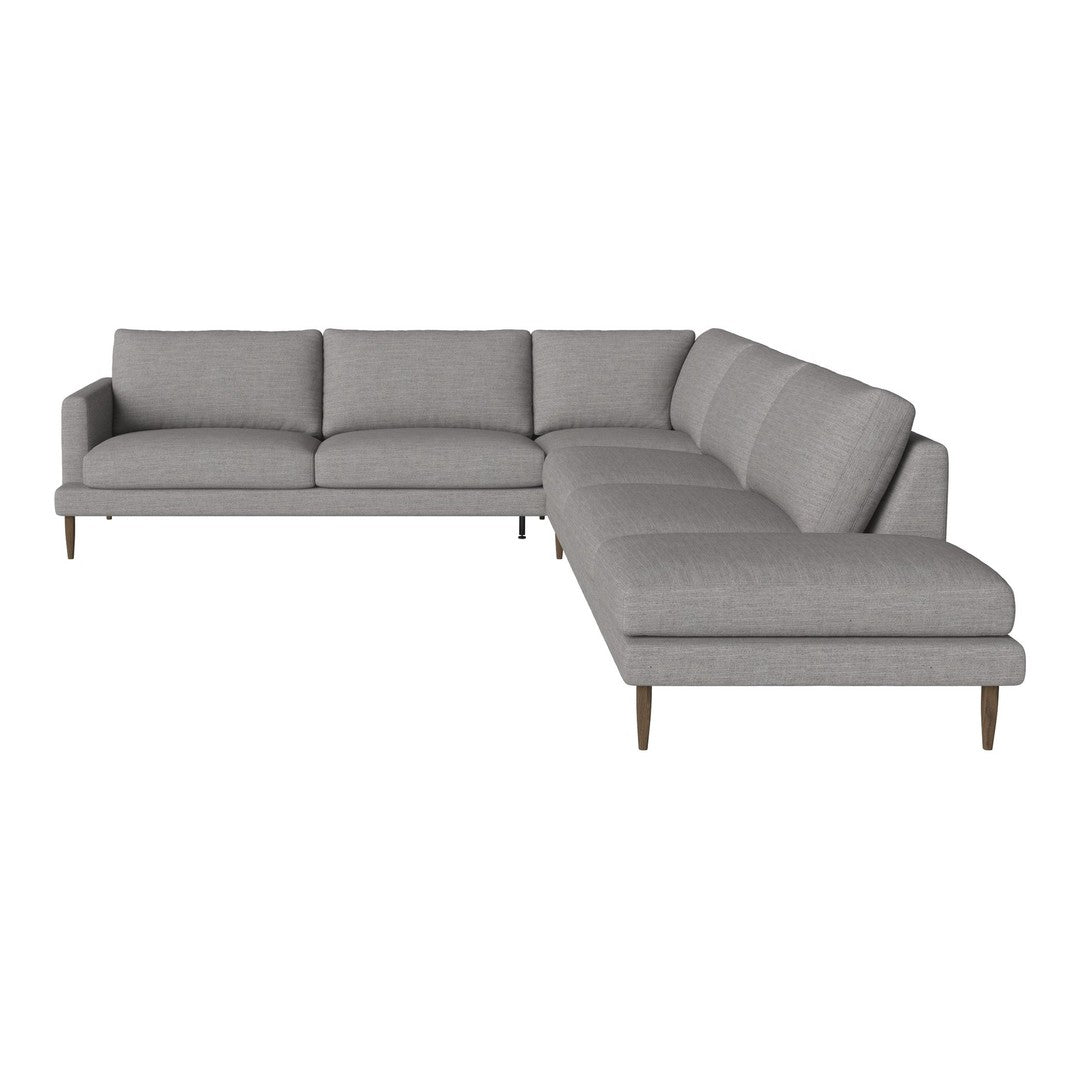 Light gray sectional sofa with a smooth texture and minimalist design, featuring clean lines and tapered wooden legs.