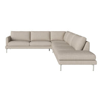 Beige sectional sofa with a smooth, textured fabric and minimalist design on sleek silver legs.