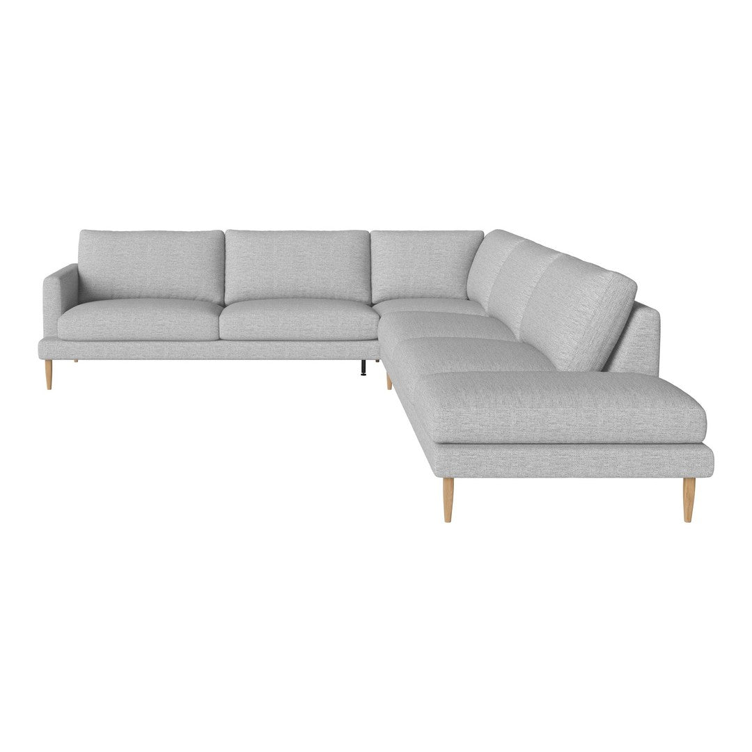 Light gray sectional sofa with clean lines and subtle texture, featuring tapered wooden legs for a modern touch.