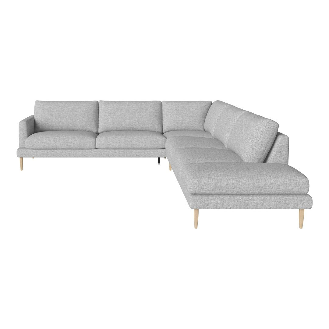 Light gray sectional sofa with a modern design and minimalistic pattern, featuring wooden legs for an elegant touch.