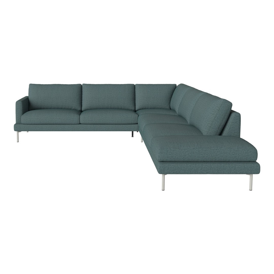 Teal sectional sofa with a sleek pattern and modern design, featuring plush cushions and minimalist silver legs.