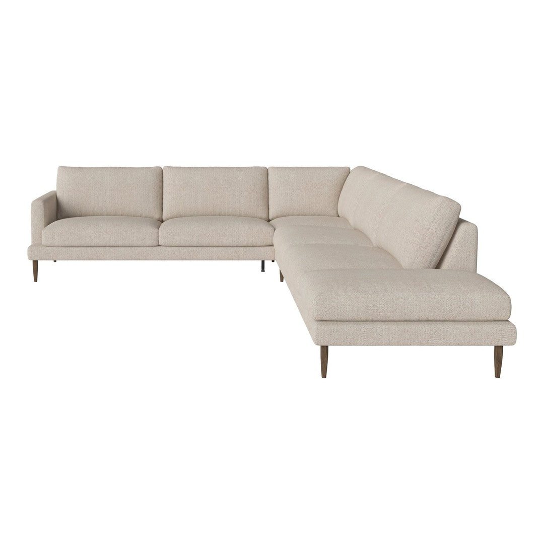 Light beige sectional sofa with a smooth, minimalist design and subtle fabric texture, perfect for modern decor.