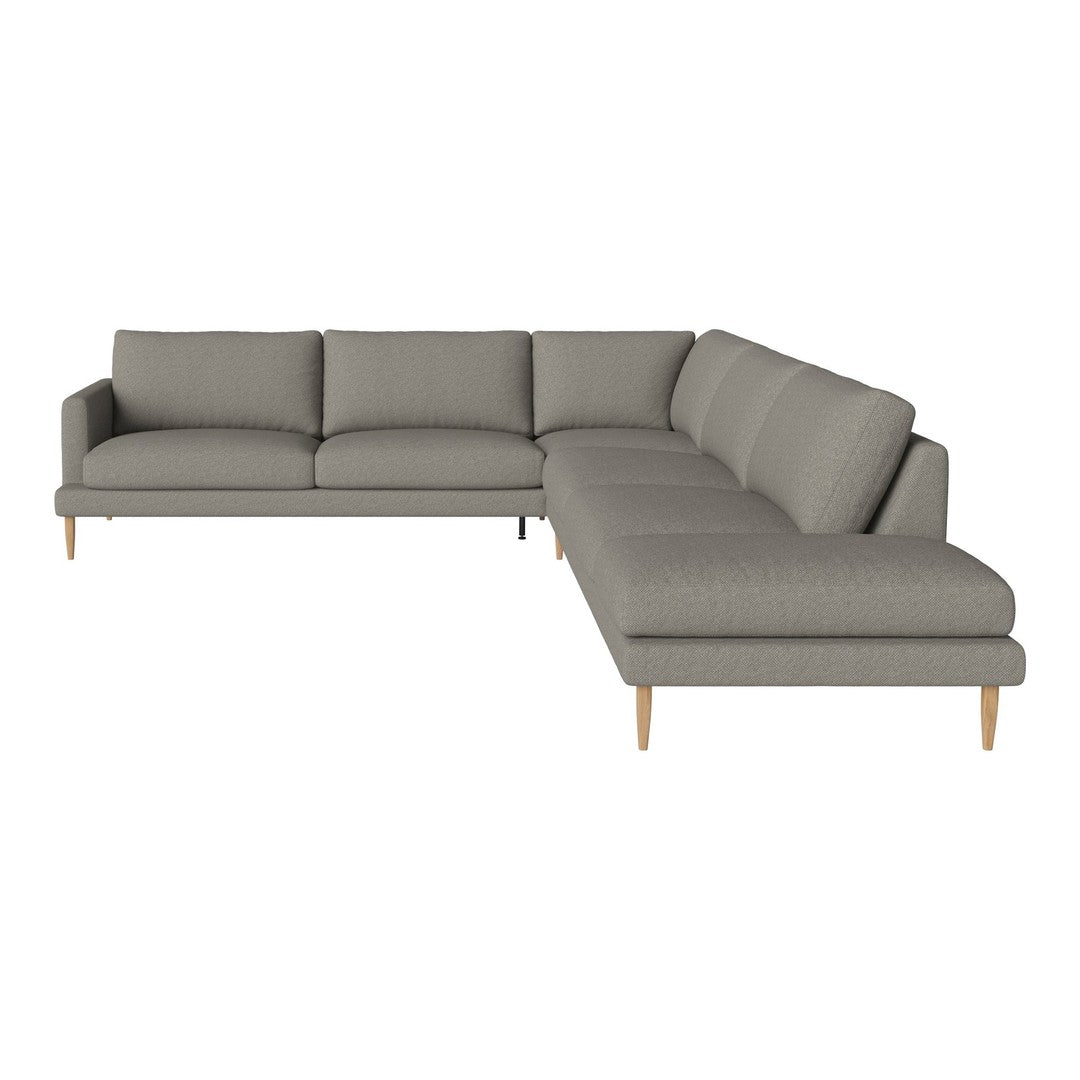 Modern grey sectional sofa with clean lines and soft fabric, featuring light wooden legs. Ideal for contemporary decor.
