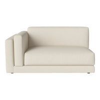Cream-colored modern sectional sofa with clean lines and minimalist design. Ideal for contemporary living spaces.