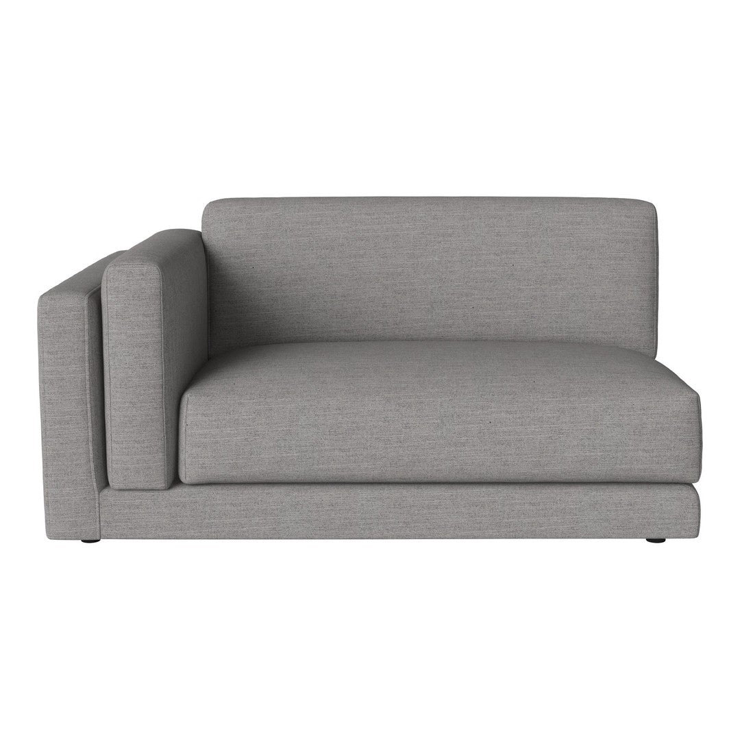 Gray sectional sofa with a sleek, modern design and subtle texture, perfect for contemporary living spaces.