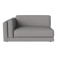 Gray sectional sofa with a sleek, modern design and subtle texture, perfect for contemporary living spaces.