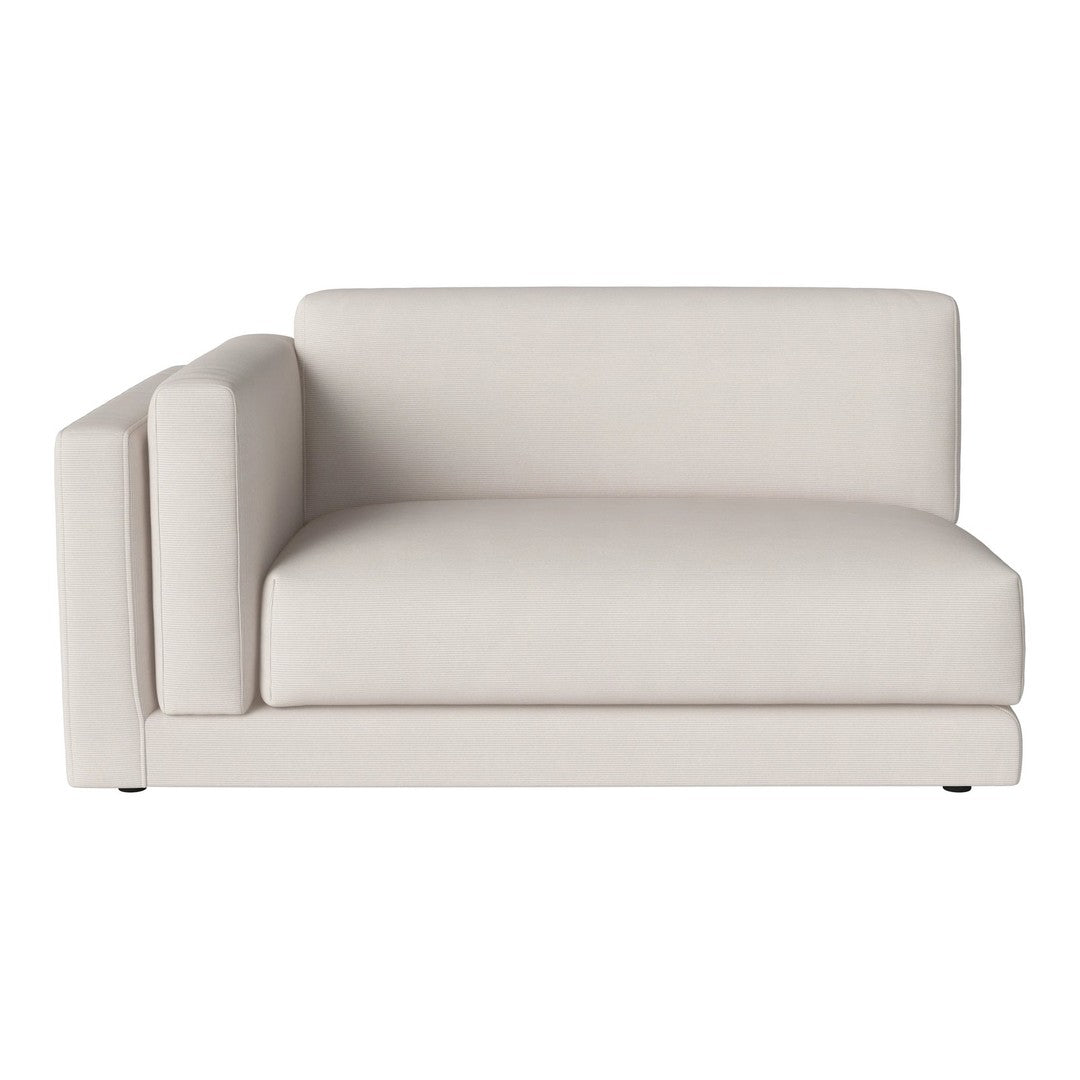 Light beige sectional sofa with a minimalist design and smooth, textured fabric. Ideal for modern decor.