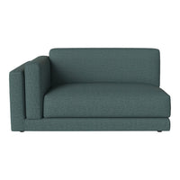 Teal upholstered modular sofa with a textured, woven pattern for a modern, stylish look.