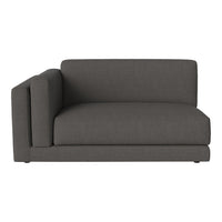 Charcoal gray sofa with a modern, minimalist design; soft, textured fabric enhances contemporary decor.