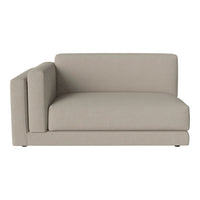 Light beige sectional sofa with a minimalist design, featuring smooth, solid-color upholstery and clean lines.