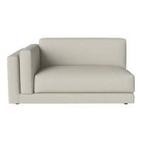 Light beige sectional sofa with a smooth texture and minimalist design, perfect for modern living spaces.