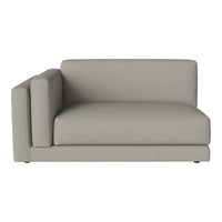 Light gray sectional sofa with a minimalist design and smooth texture, perfect for modern living spaces.