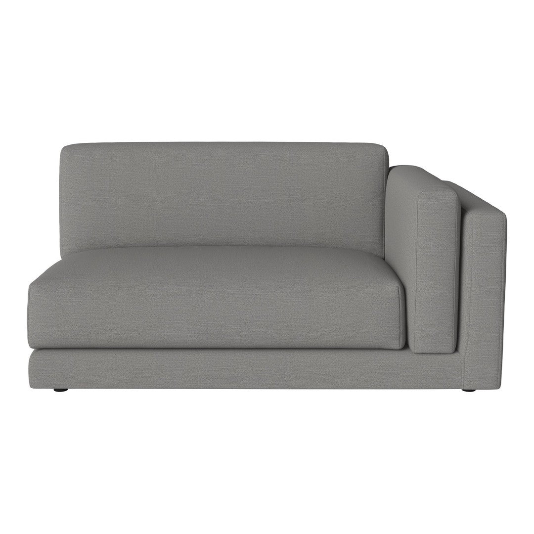 Gray sectional sofa with smooth fabric and minimalist design, perfect for modern living spaces.