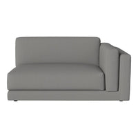 Gray sectional sofa with smooth fabric and minimalist design, perfect for modern living spaces.