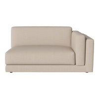 Beige upholstered sectional sofa with a smooth, modern design and clean lines, perfect for any living space.