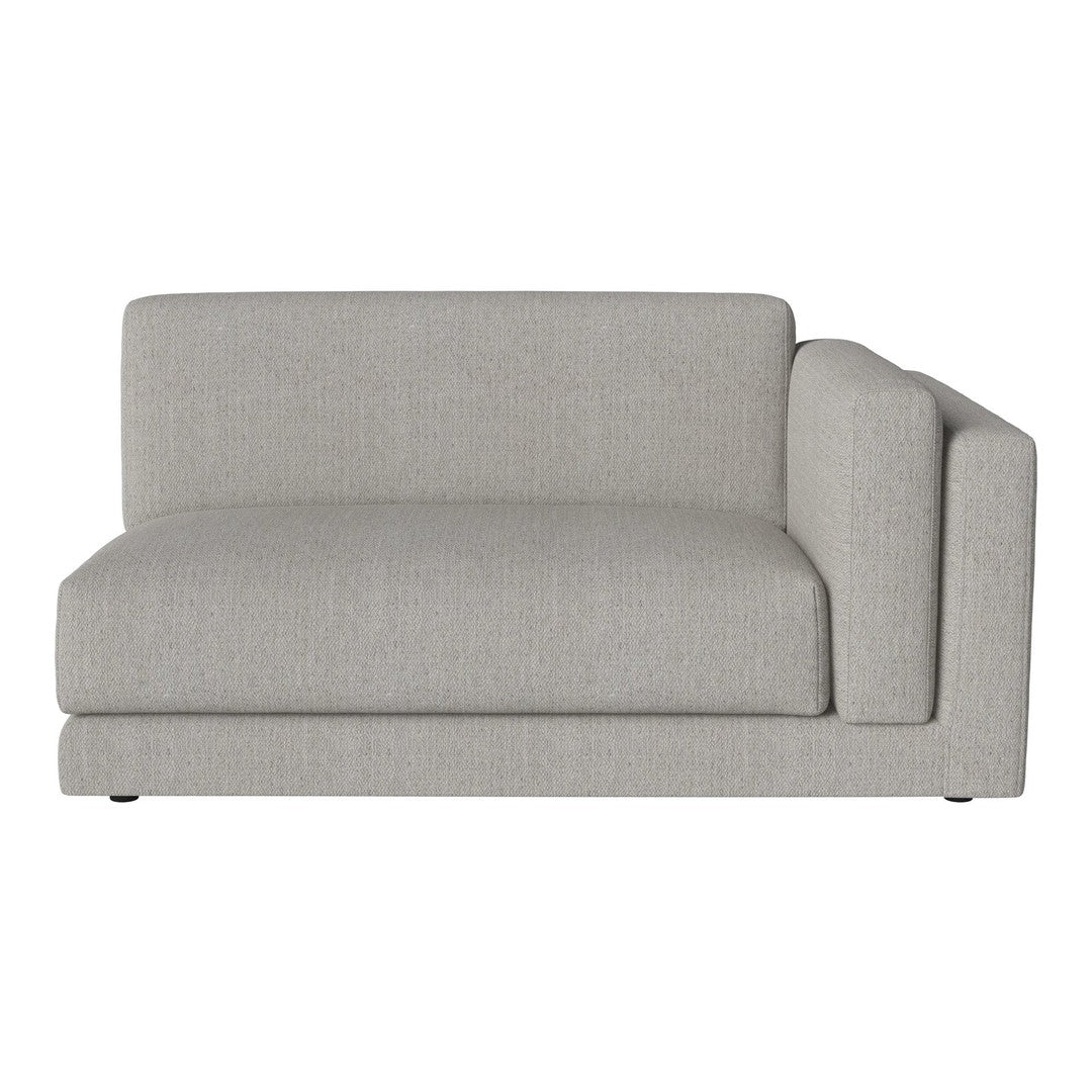 Gray upholstered sectional sofa with a minimalist design and smooth, textured fabric. Perfect for modern interiors.