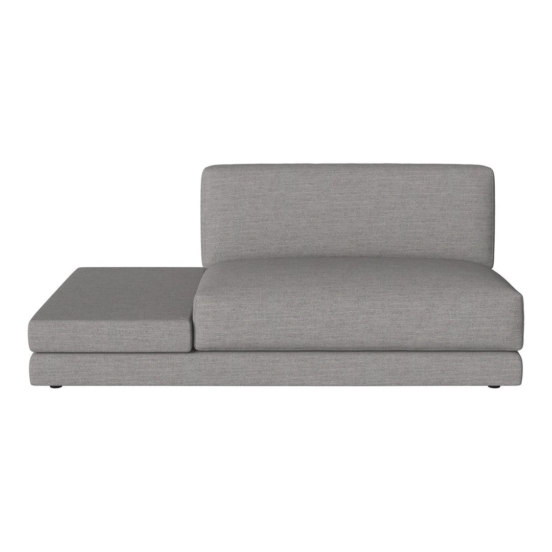 Gray upholstered chaise lounge with a sleek, minimalist design and subtle texture. Perfect for modern interiors.