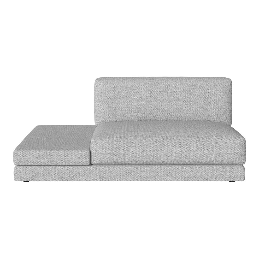 Gray sectional sofa with a sleek, minimalist design and soft fabric texture, ideal for modern living spaces.